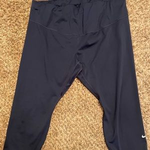 Blue Nike capri length leggings.